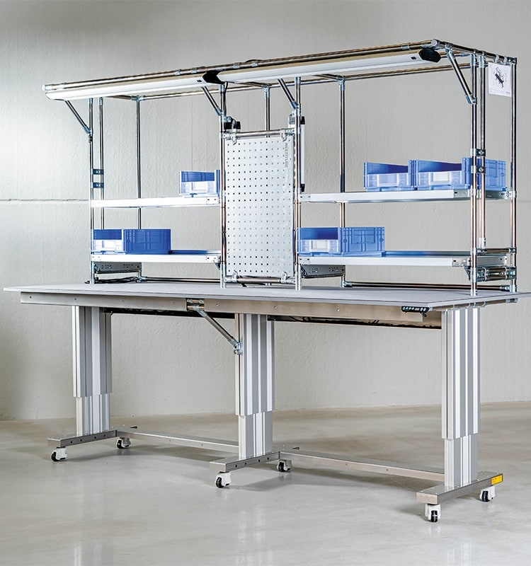 Electrically height adjustable workbenches